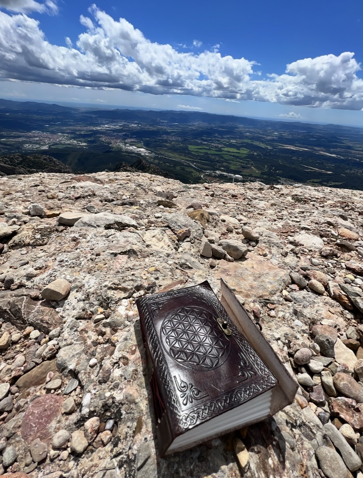 Her notebook on the stones at the summit of Montserrat
